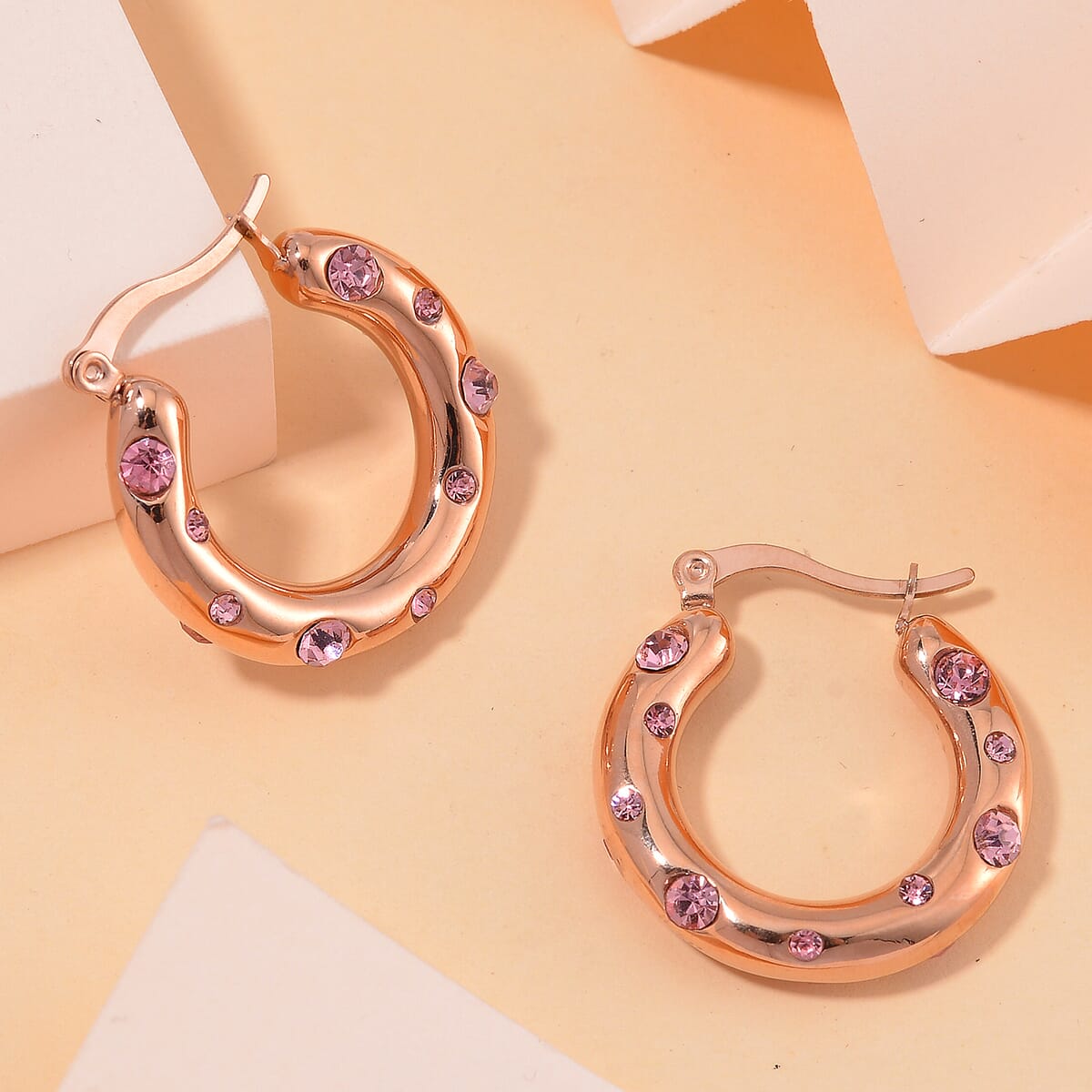 Pink Austrian Crystal Hoop Earrings in ION Plated RG Stainless Steel image number 1