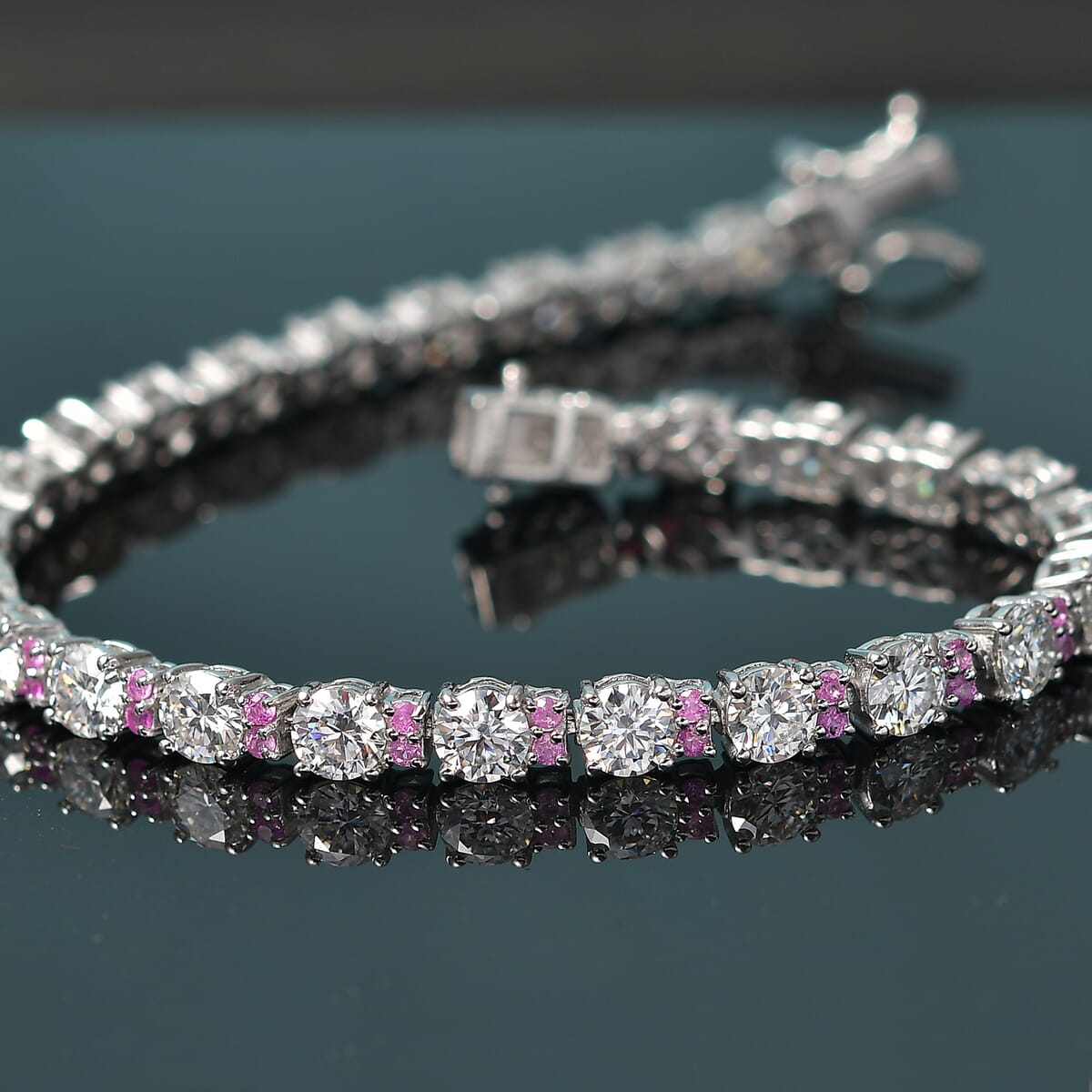 Moissanite and Madagascar Pink Sapphire 10.80 ctw Moonlit Tennis Bracelet in Rhodium Over Sterling Silver (6.50 In) image number 1