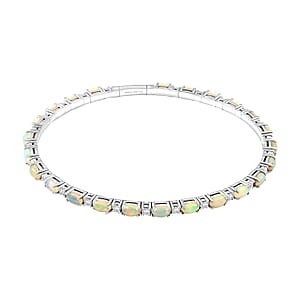 Modani Ethiopian Welo Opal and White Topaz 6.21 ctw Bangle Bracelet (8.00 In) in Sterling Silver with 1.5g Titanium Spring