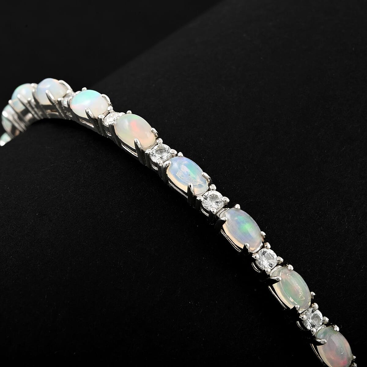 Modani Ethiopian Welo Opal and White Topaz 6.21 ctw Bangle Bracelet (8.00 In) in Sterling Silver with 1.5g Titanium Spring image number 1