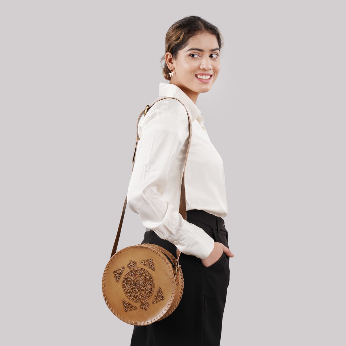 Tan Flower Pattern Genuine Leather Round Embossed Sling Bag with Adjustable Shoulder Strap (10"x3.5") image number 1
