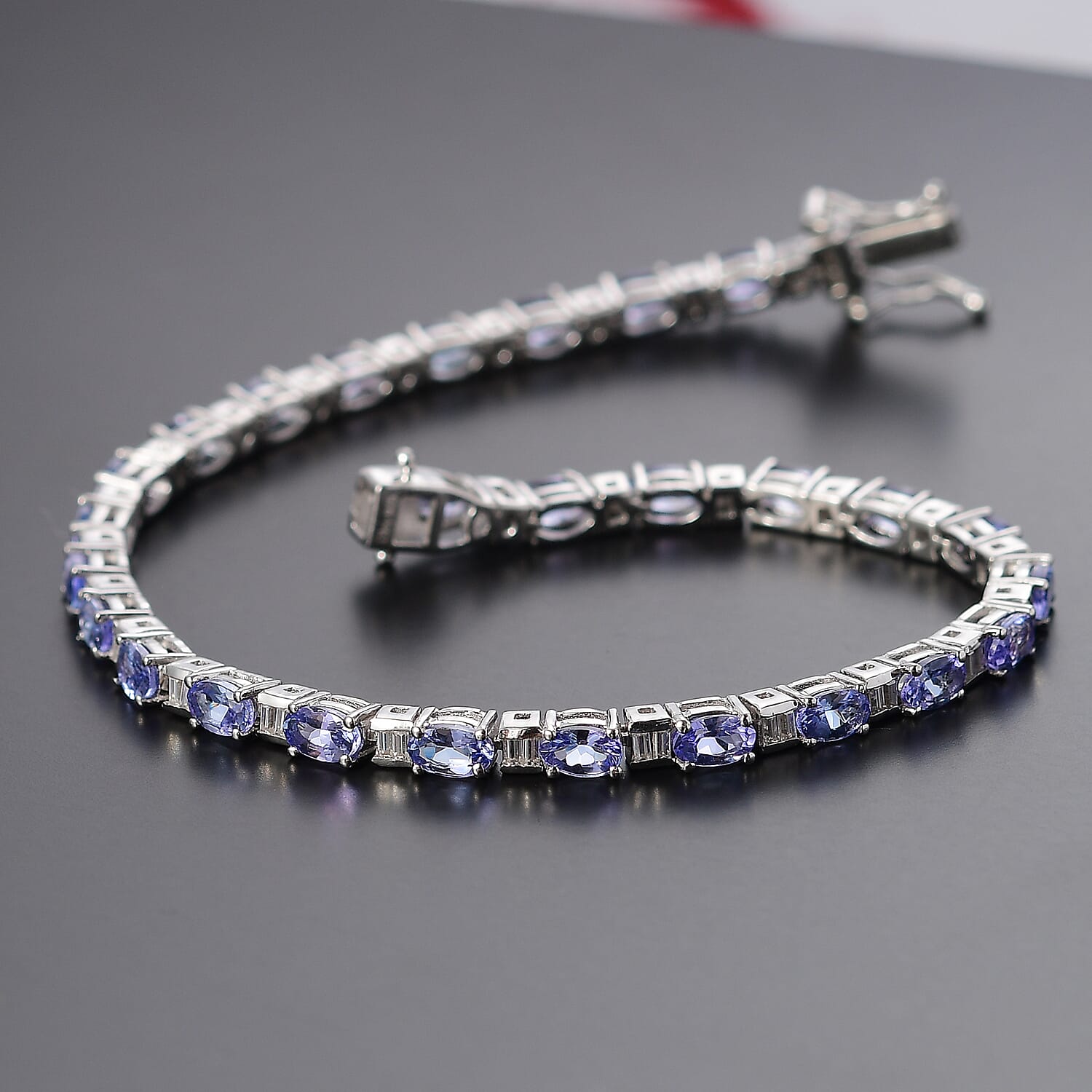 Tanzanite and Moissanite 6.15 ctw Bracelet in Rhodium Over Sterling Silver (6.50 In)