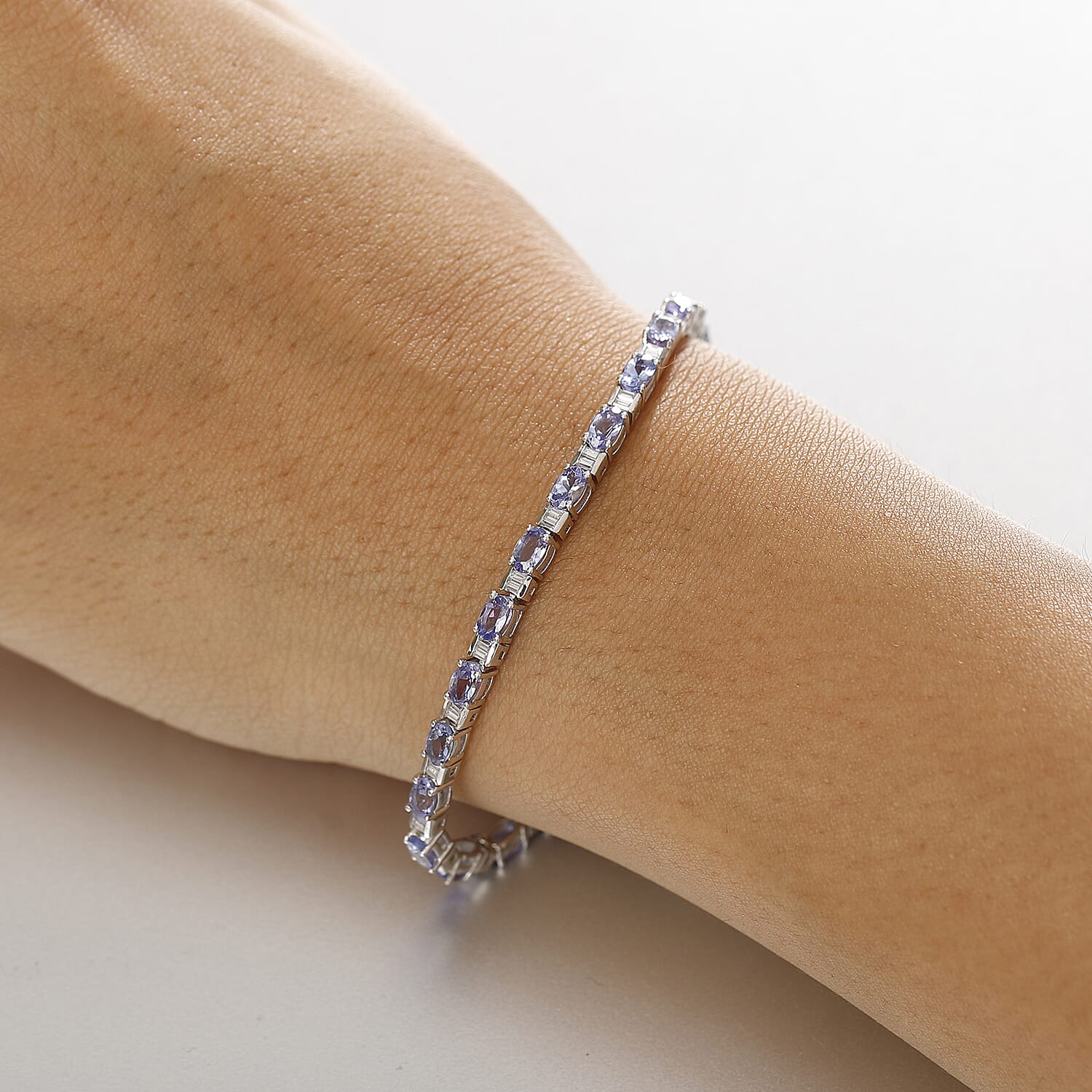 D'Joy Tanzanite and Moissanite 6.15 ctw Radiance Tennis Bracelet in Rhodium Over Sterling Silver (6.50 In)