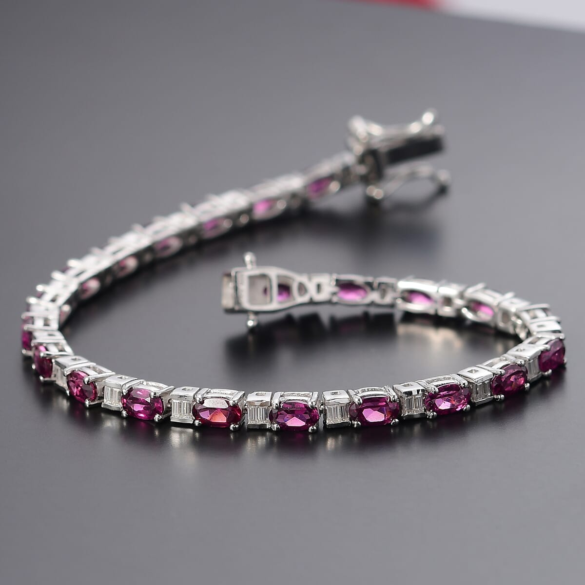 Radiant Ember Garnet and Moissanite 9.40 ctw Radiance Tennis Bracelet in Rhodium Over Sterling Silver (8.00 In) image number 1