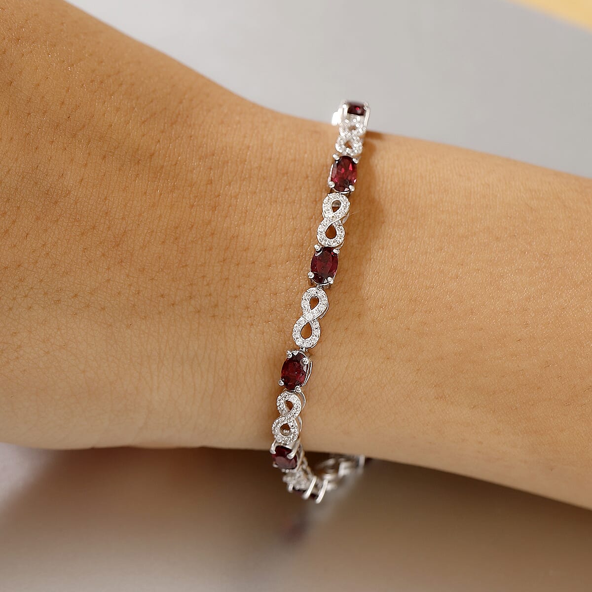 Premium Orissa Rhodolite Garnet and White Zircon 7.30 ctw Infinity Love Bracelet in Rhodium Over Sterling Silver (6.50 In) image number 2