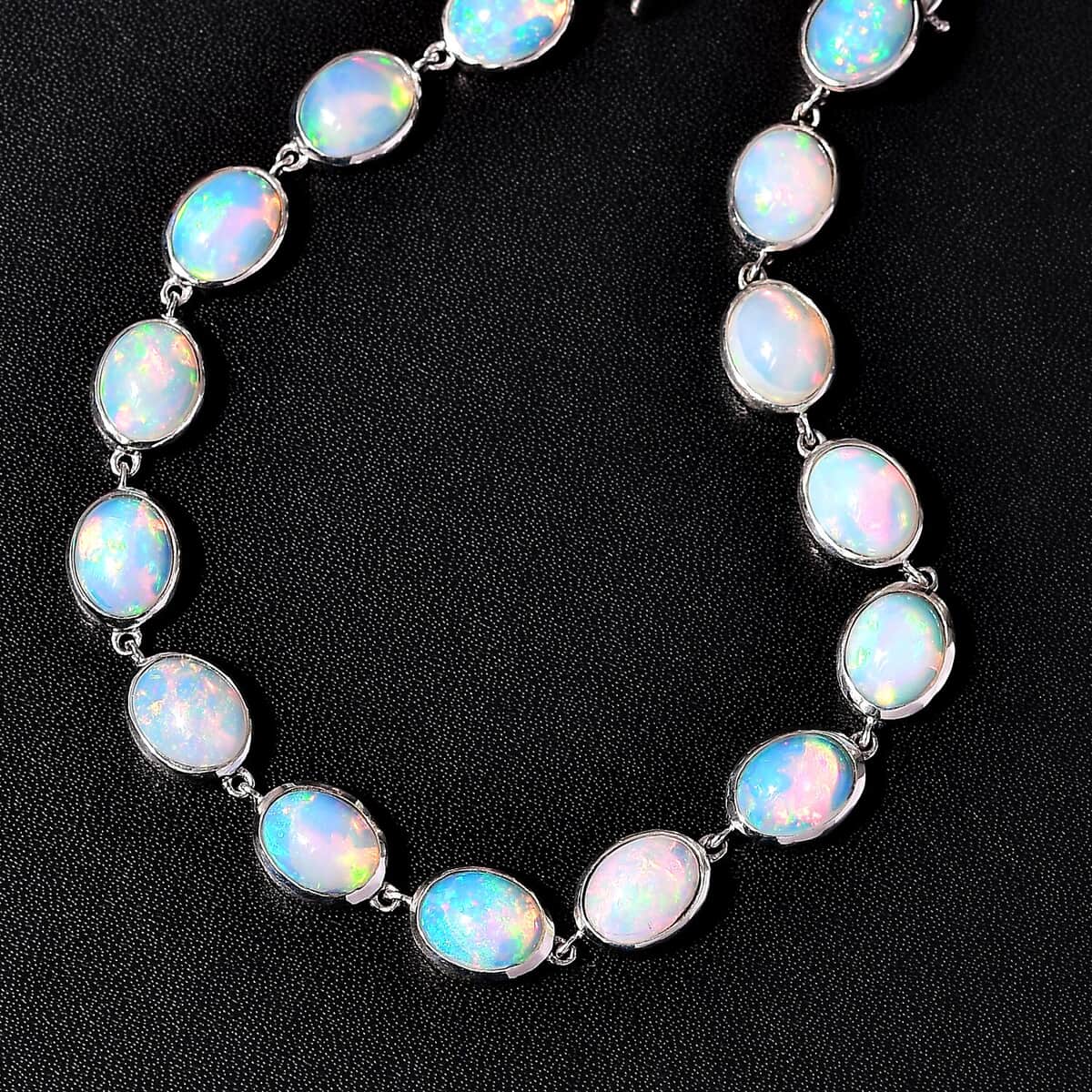 Premium Ethiopian Welo Opal 13.30 ctw Dolphin Bracelet in Rhodium Over Sterling Silver (6.50 In) image number 1