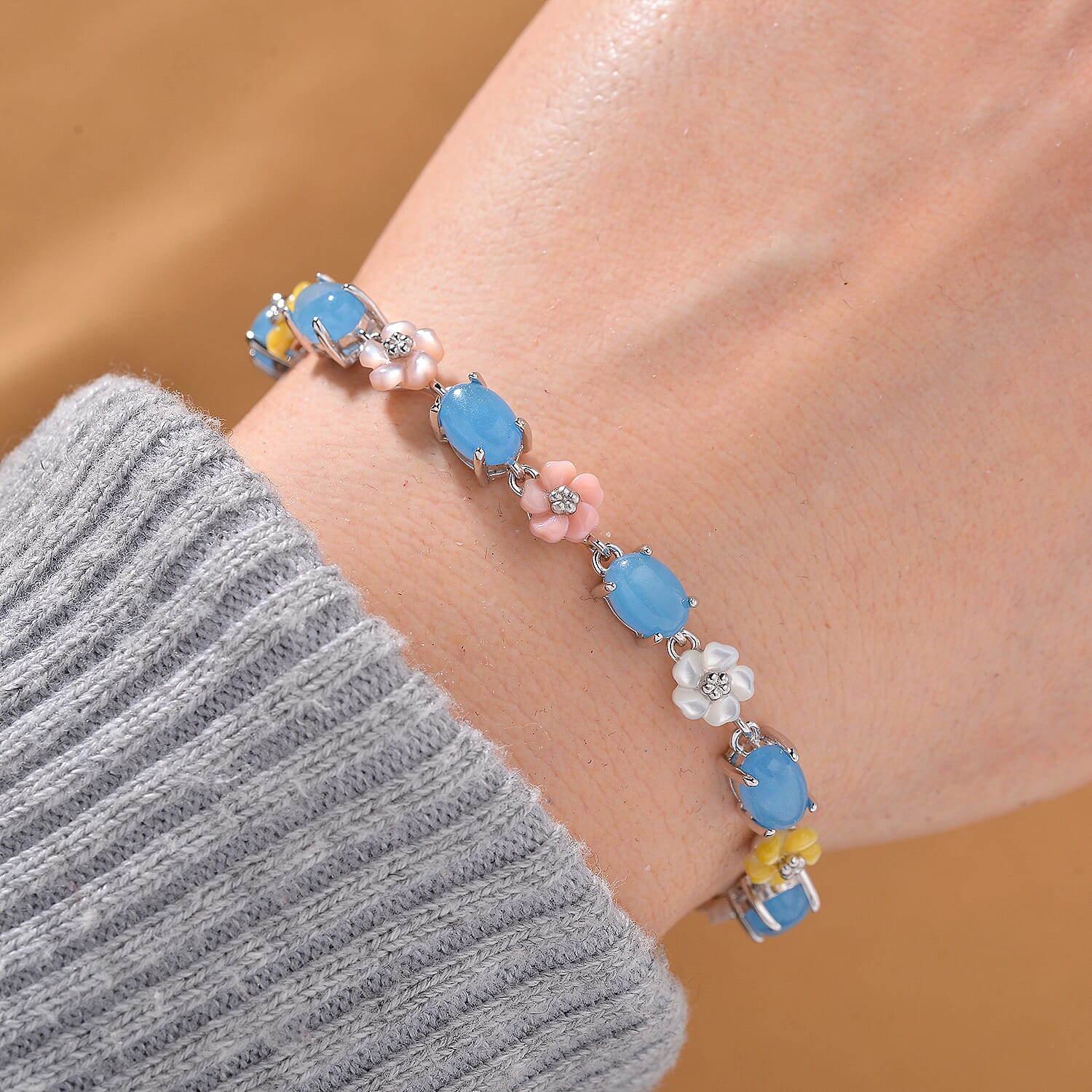 Blue Jade (D) 10.40 ctw and Multi Color Mother of Pearl Carved Floral Bracelet in Rhodium Over Sterling Silver (6.50 In)