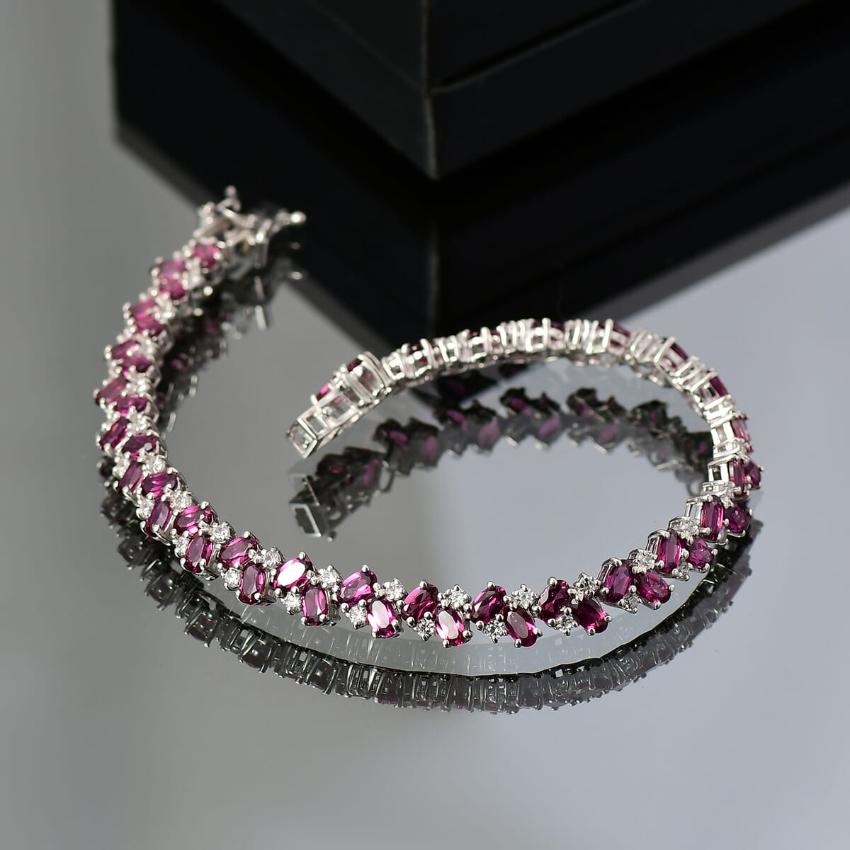 D'Joy Radiant Ember Garnet and White Zircon 16.50 ctw Sea Waves Bracelet in Rhodium Over Sterling Silver (7.25 In) image number 1