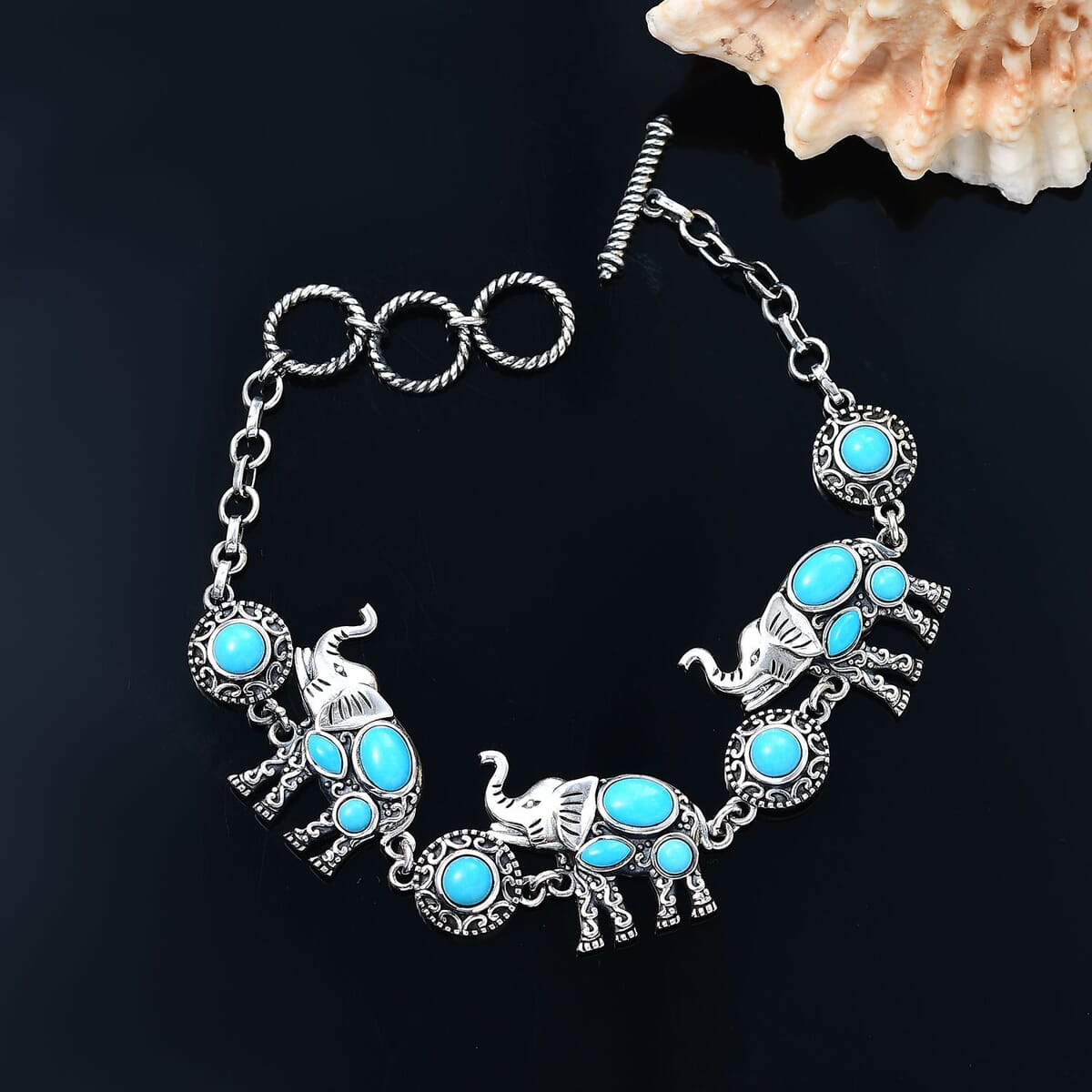 Indian Artisan Crafted Sleeping Beauty Turquoise 5.50 ctw Majestic Elephants Bracelet in Sterling Silver (6.50-8.0In) image number 1