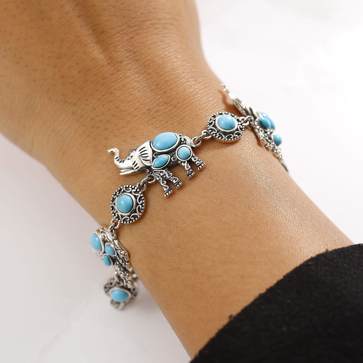 Indian Artisan Crafted Sleeping Beauty Turquoise 5.50 ctw Majestic Elephants Bracelet in Sterling Silver (6.50-8.0In) image number 2