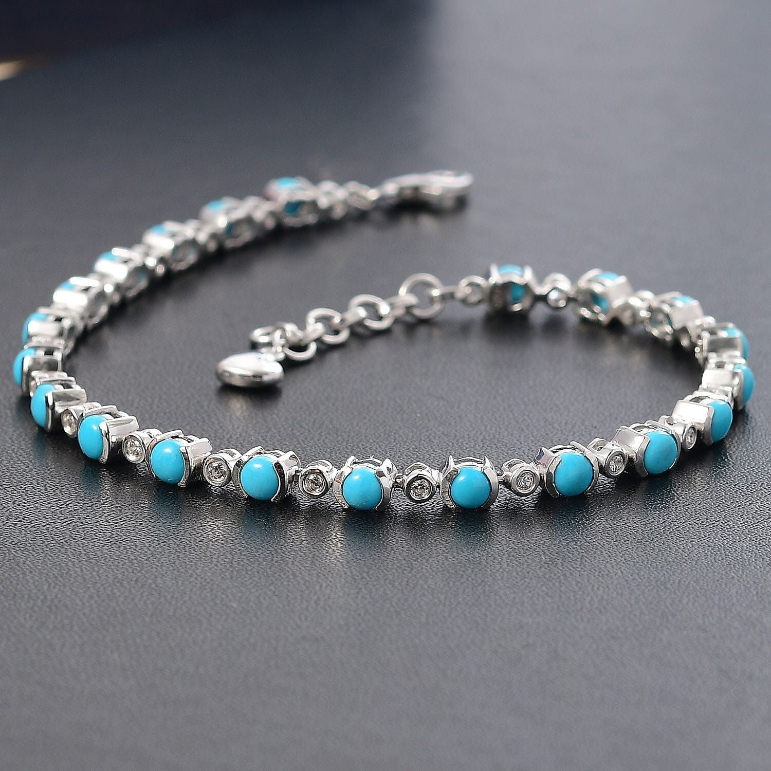 Premium Sleeping Beauty Turquoise and White Zircon 7.15 ctw Bracelet in Rhodium Over Sterling Silver (7.5 In) (10.1 g)