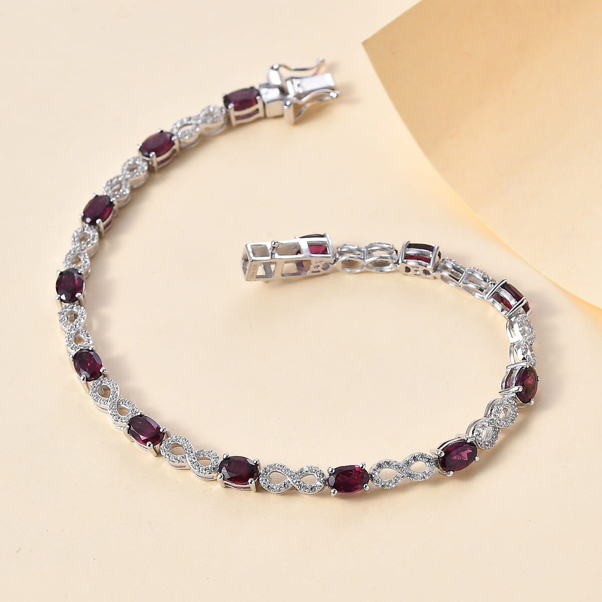 Premium Orissa Rhodolite Garnet and White Zircon 9.50 ctw Infinity Love Bracelet in Rhodium Over Sterling Silver (8.00 In) image number 1