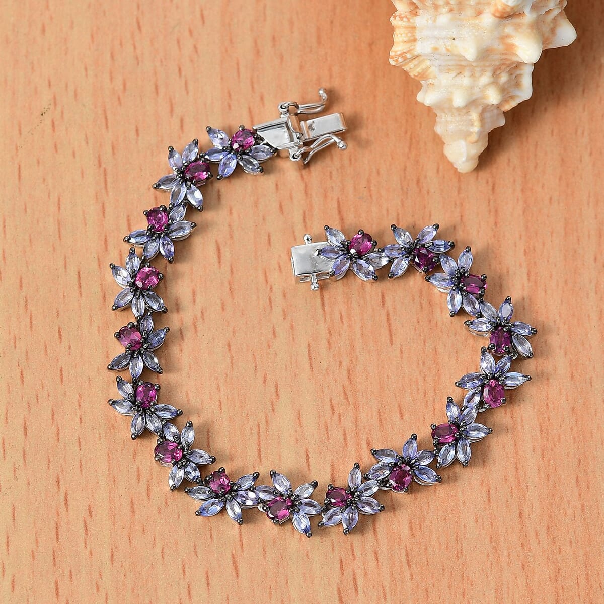 AAA Radiant Ember Garnet and Tanzanite 12.00 ctw Floral Link Bracelet in Rhodium Over Sterling Silver (7.25 In) image number 1