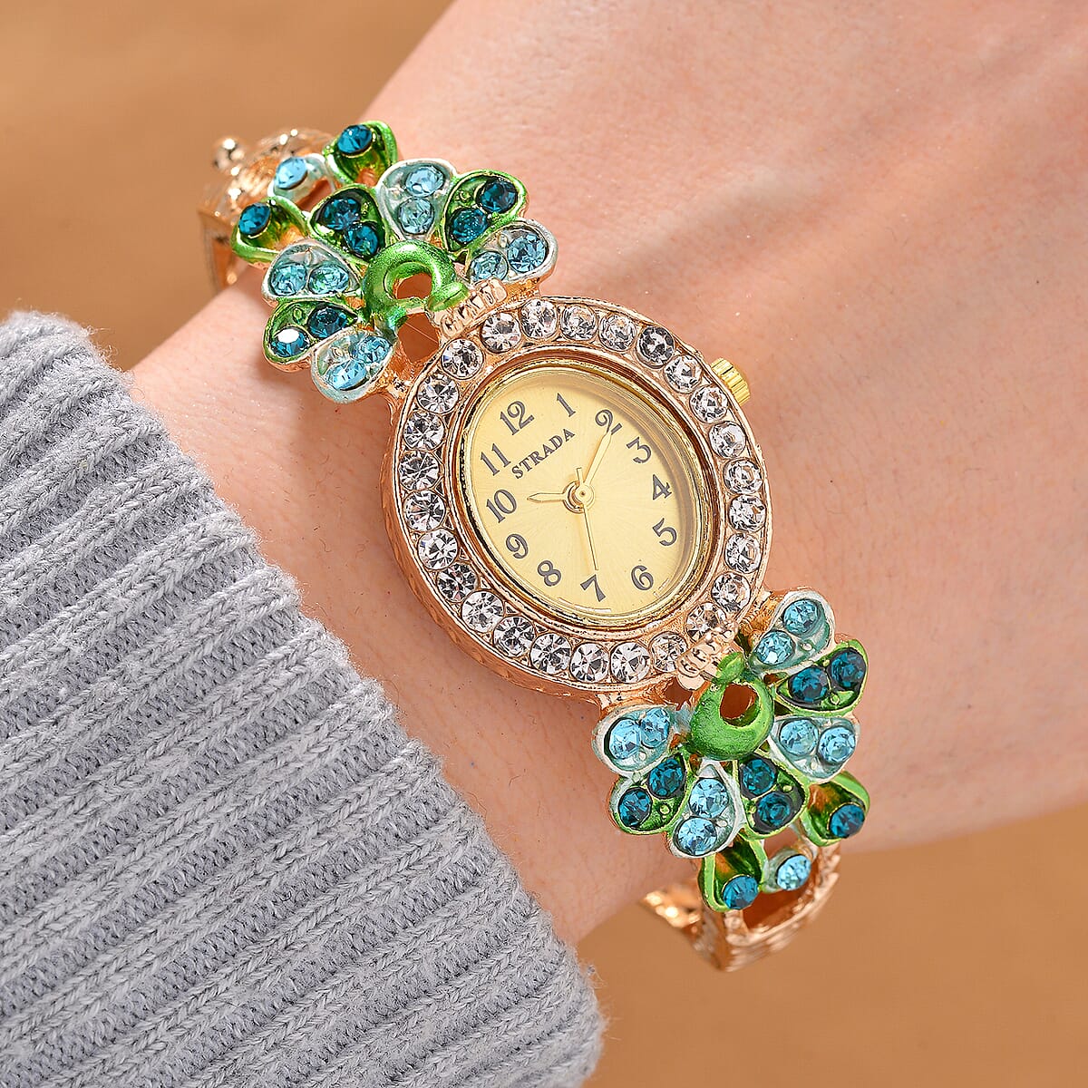 Strada Multi Color Crystal and Enameled Japanese Movement Peacock Bangle Bracelet Watch in Goldtone image number 1