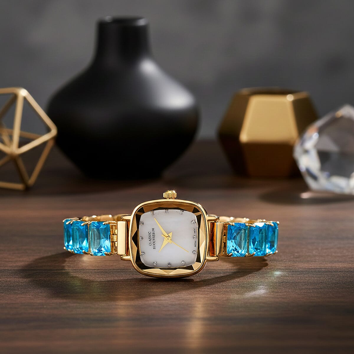 Classic Succession Austrian Crystal Miyota Japanese Movement Watch with Simulated Blue Diamond Strap in Goldtone and Stainless Steel Buckle 12.00 ctw image number 1