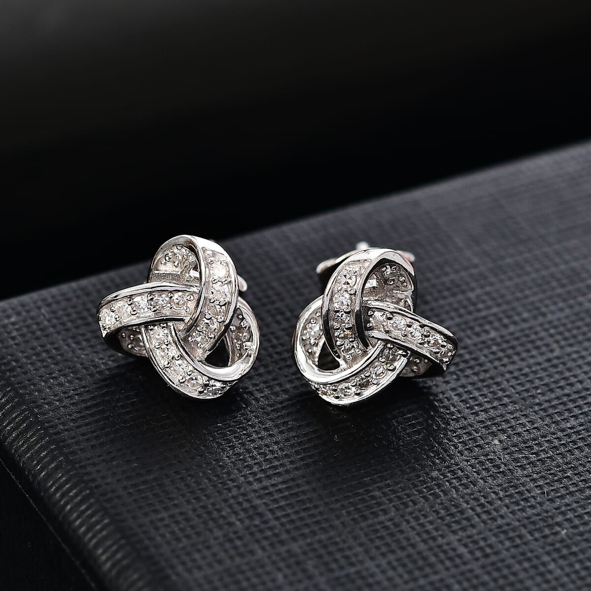 Luxuriant Lab Grown Diamond G-H SI 0.20 ctw Knot Earrings in Rhodium Over Sterling Silver image number 1