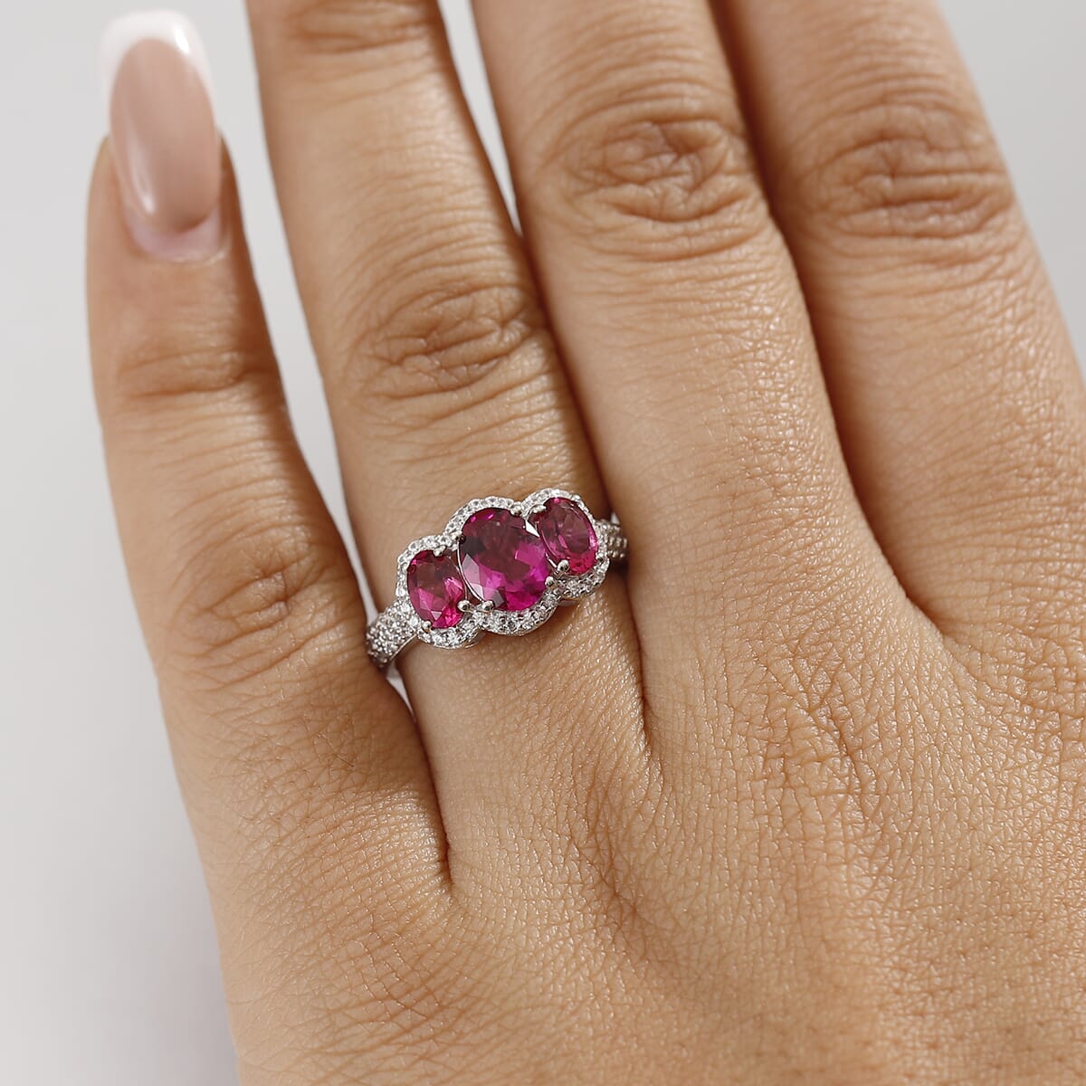 Luxuriant Premium Bixbite (LG) and White Zircon 2.65 ctw Trilogy Ring in Rhodium Over Sterling Silver (Size 9.0) image number 2