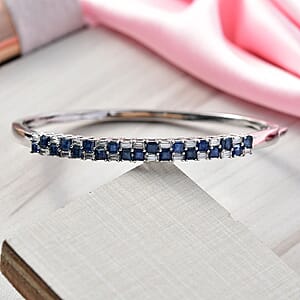 D'Joy Blue Sapphire and Moissanite 4.65 ctw Midnight Lineage Bangle Bracelet in Rhodium Over Sterling Silver (7.25 In)