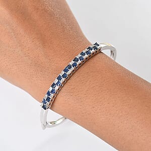 D'Joy Blue Sapphire and Moissanite 4.65 ctw Midnight Lineage Bangle Bracelet in Rhodium Over Sterling Silver (7.25 In)