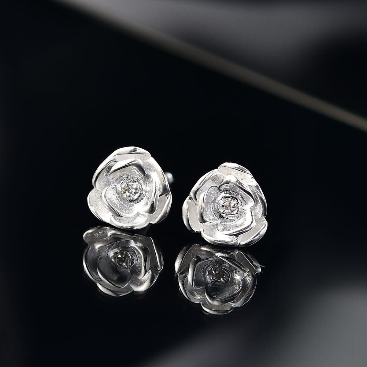 Luxuriant Lab Grown Diamond (VS) Accent Floral Stud Earrings in Sterling Silver image number 1