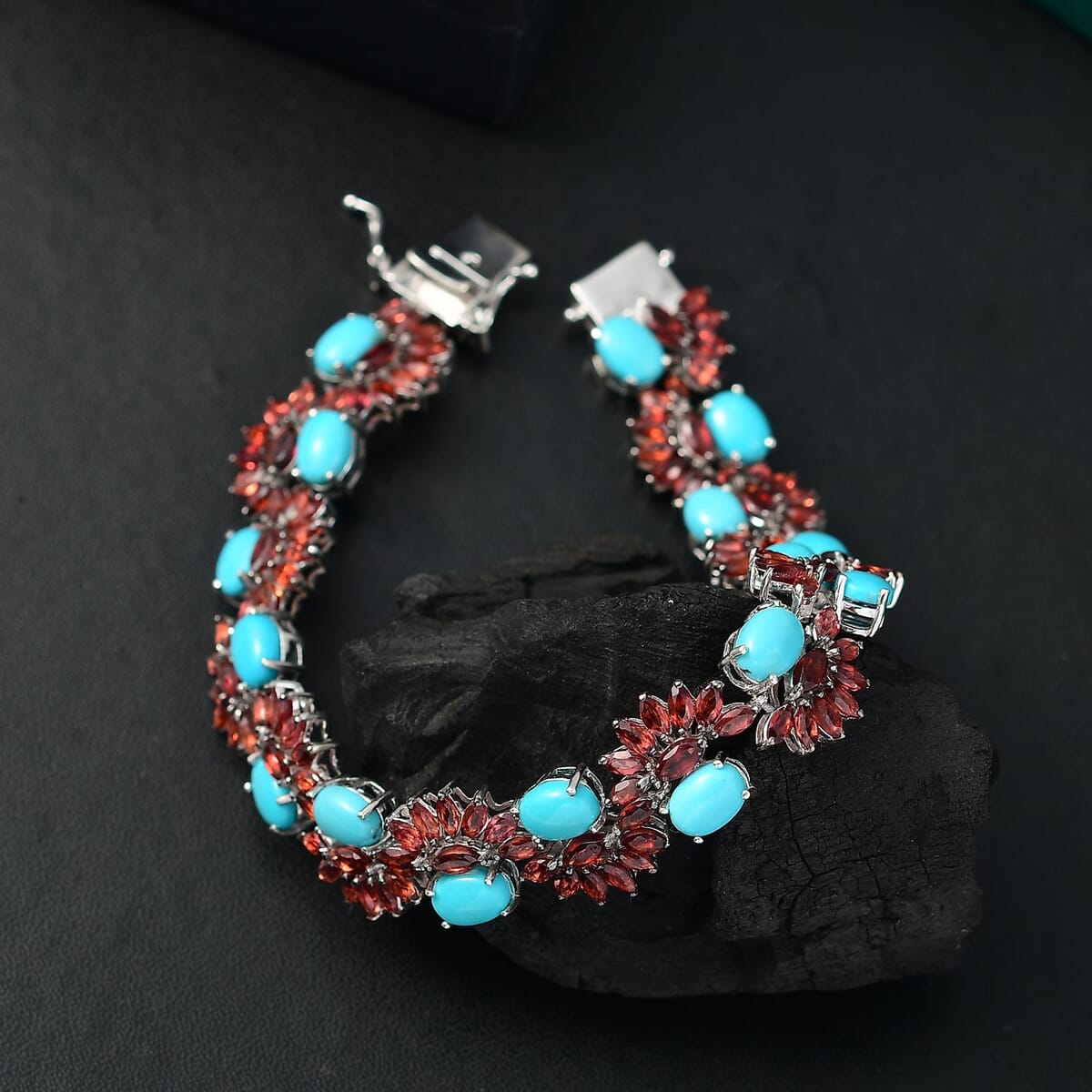 D'Joy Premium Sleeping Beauty Turquoise and Mozambique Garnet 28.60 ctw Floral Symphony Bracelet in Rhodium Over Sterling Silver (7.25 In) image number 1