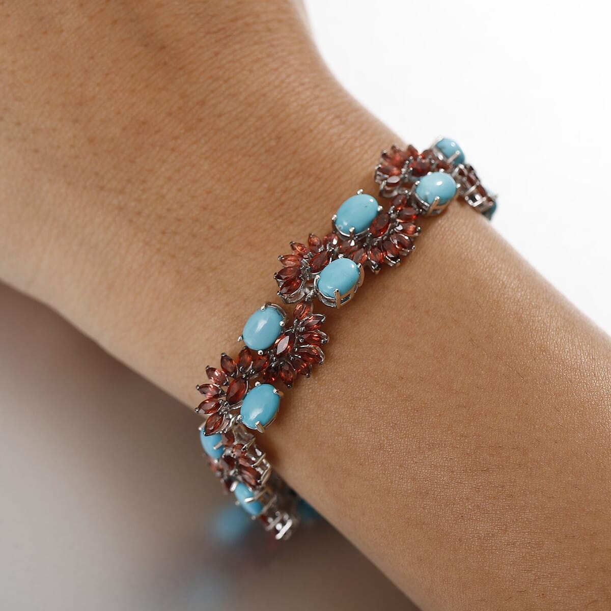 D'Joy Premium Sleeping Beauty Turquoise and Mozambique Garnet 28.60 ctw Floral Symphony Bracelet in Rhodium Over Sterling Silver (7.25 In) image number 2