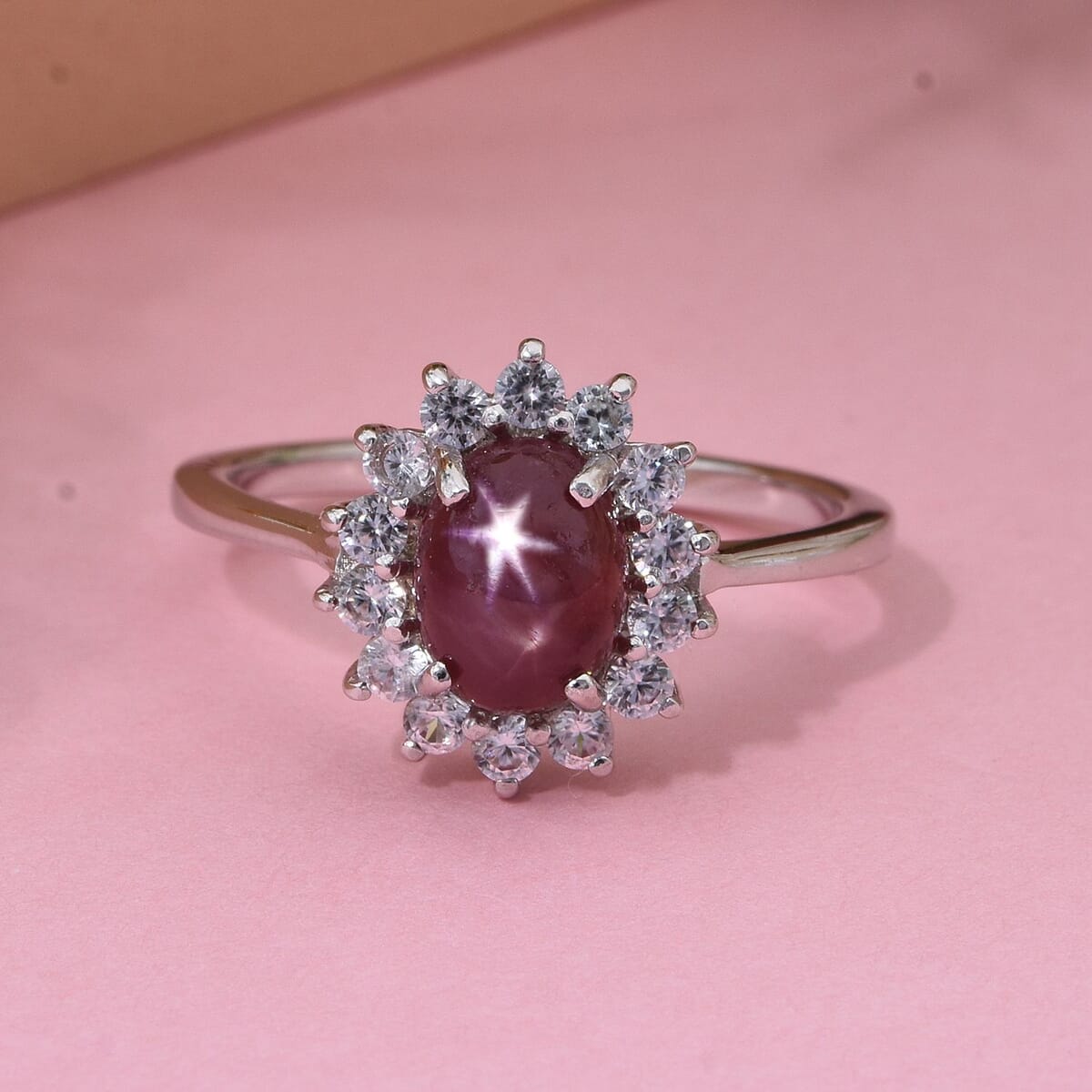 Premium Indian Star Ruby and White Zircon 2.75 ctw Sunburst Ring in Rhodium Over Sterling Silver (Size 7.0) image number 1