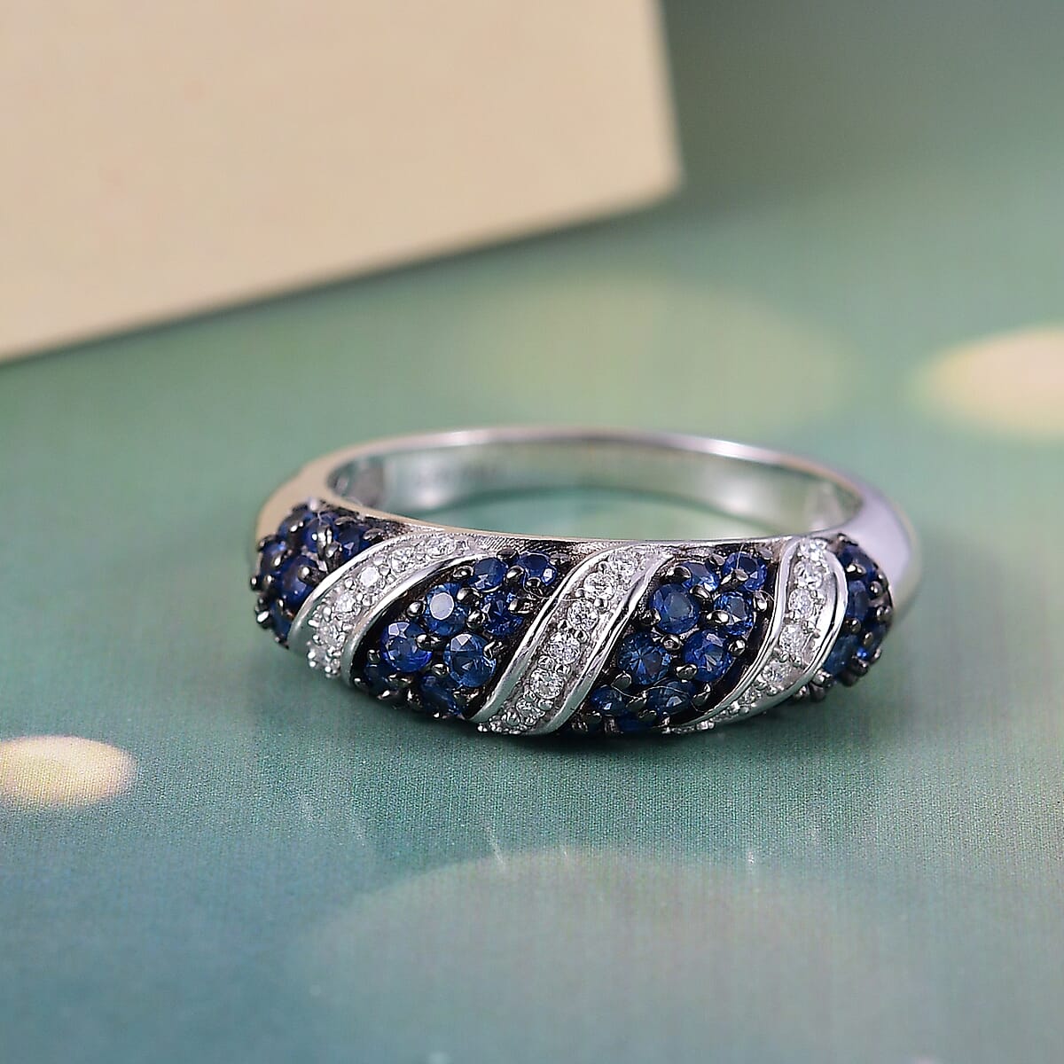 Ceylon Blue Sapphire and Moissanite 1.00 ctw Wave Ring in Rhodium Over Sterling Silver (Size 6.0) image number 1