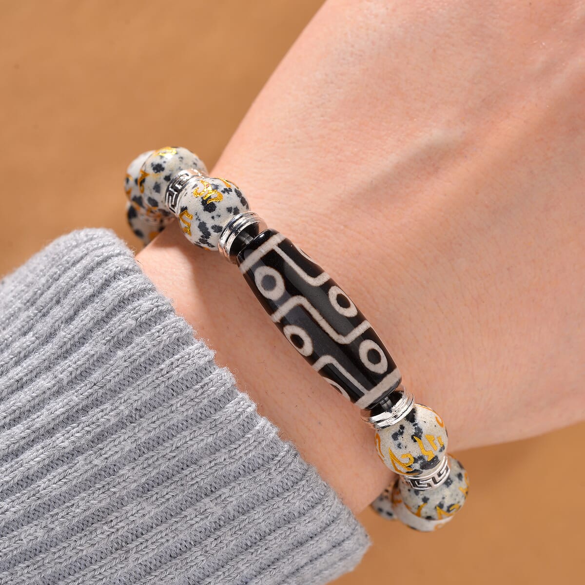 Nine Eyed Agate Dzi Beads and Dalmation Jasper 135 ctw Feng Shui Beaded Stretch Bracelet in Silvertone image number 1