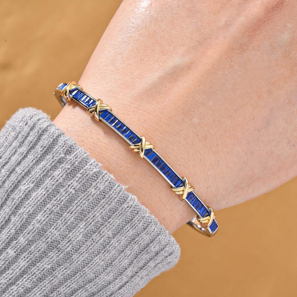 Karis Simulated Blue Diamond XOXO Bangle Bracelet in 18K YG Plated and Platinum Bond (7.50 In) image number 1