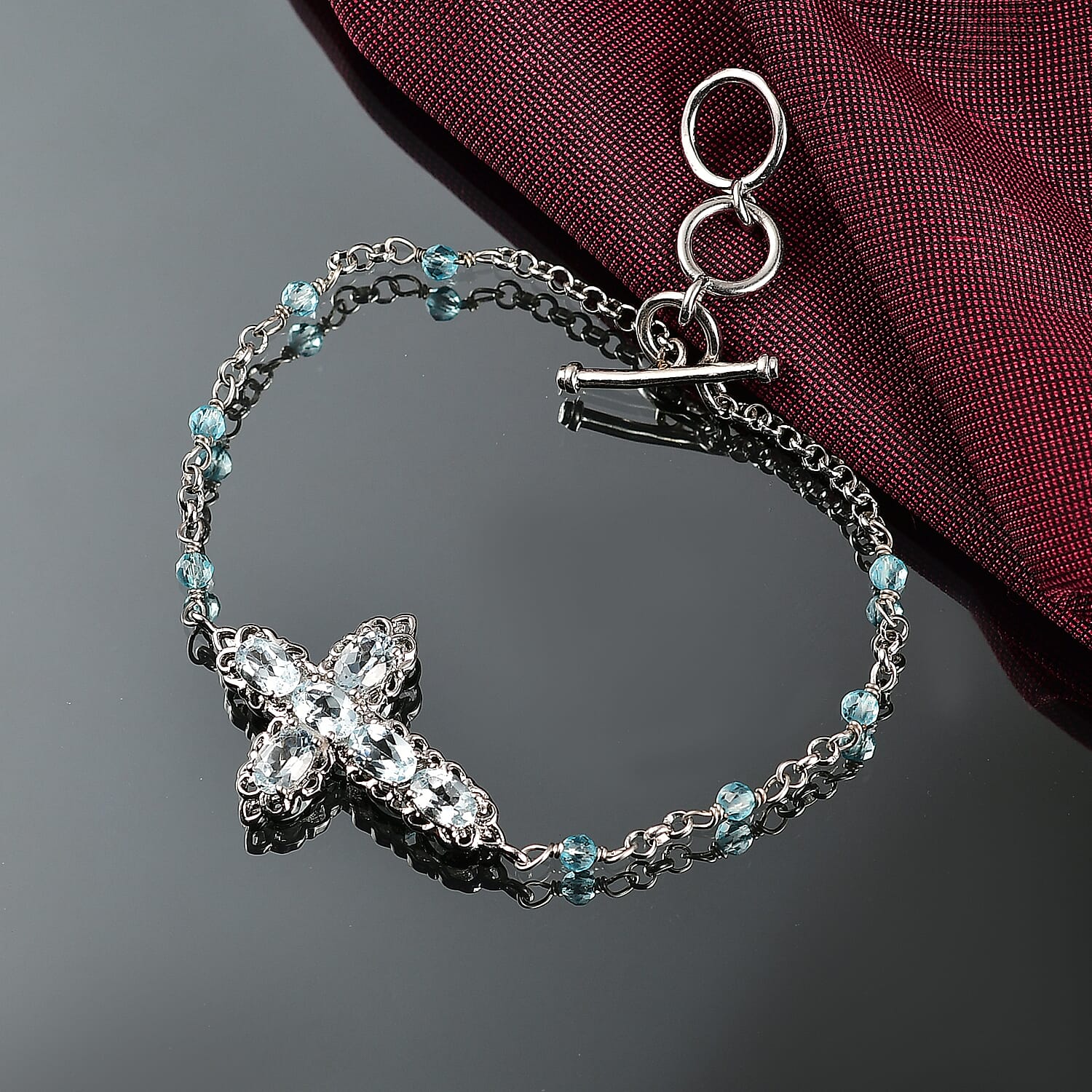 EverTrue Sky Blue Topaz 4.30 ctw Cross Bracelet in Platinum Bond (6.50-8.0In)