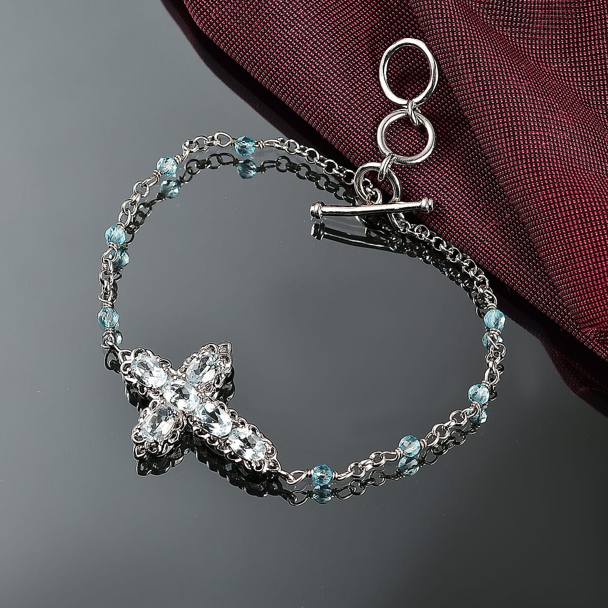 EverTrue Sky Blue Topaz 4.30 ctw Cross Bracelet in Platinum Bond (6.50-8.0In) image number 1