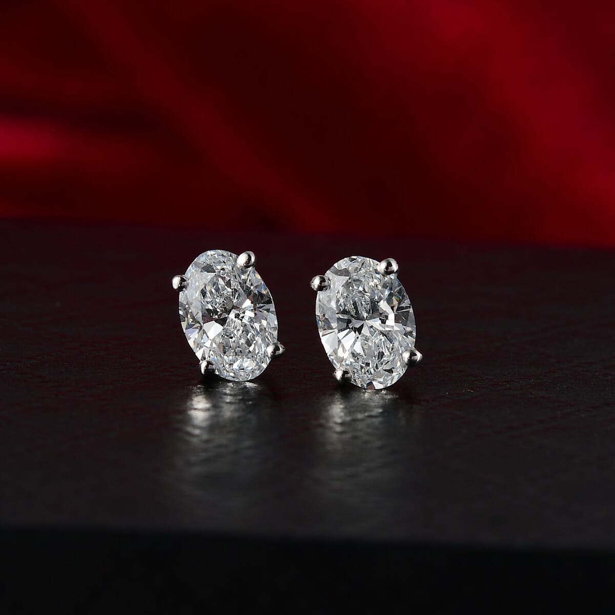 Luxuriant Lab Grown Diamond E-F VS 1.50 ctw Solitaire Stud Earrings in 10K White Gold  image number 1