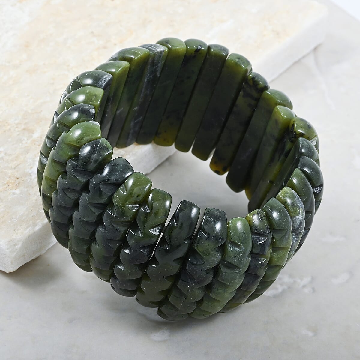 Carved Dark Olive Jade 583.00 ctw Wavy Stretch Bracelet (6-7In) image number 1