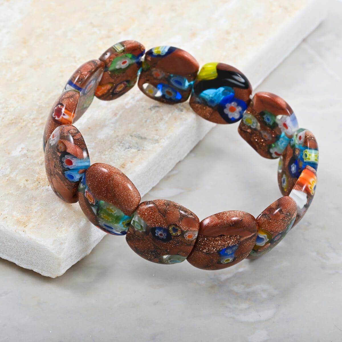Brown Goldstone 128.55 ctw with Flower Cushion Stretch Bracelet (6-7In) image number 1