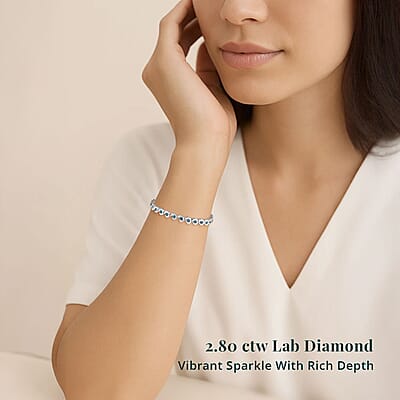 Luxuriant Lab Grown Blue Diamond (IR) 2.80 ctw Waves of Light Bracelet in Rhodium Over Sterling Silver (6.50 In)