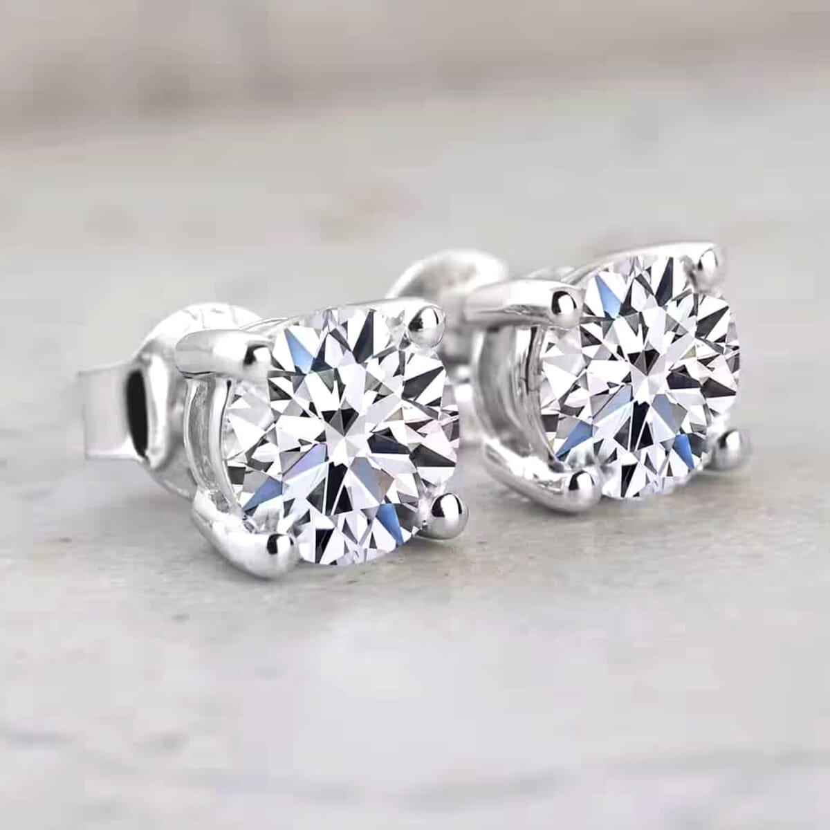 IGI Certified Luxuriant Lab Grown Diamond E-F VS 2.00 ctw Solitaire Stud Earrings in 10K White Gold image number 7