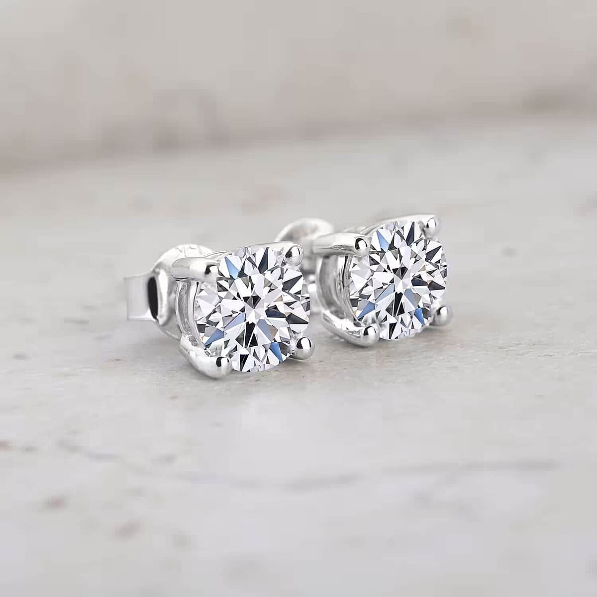 IGI Certified Luxuriant Lab Grown Diamond E-F VS 1.00 ctw Solitaire Stud Earrings in Rhodium Over Sterling Silver image number 1