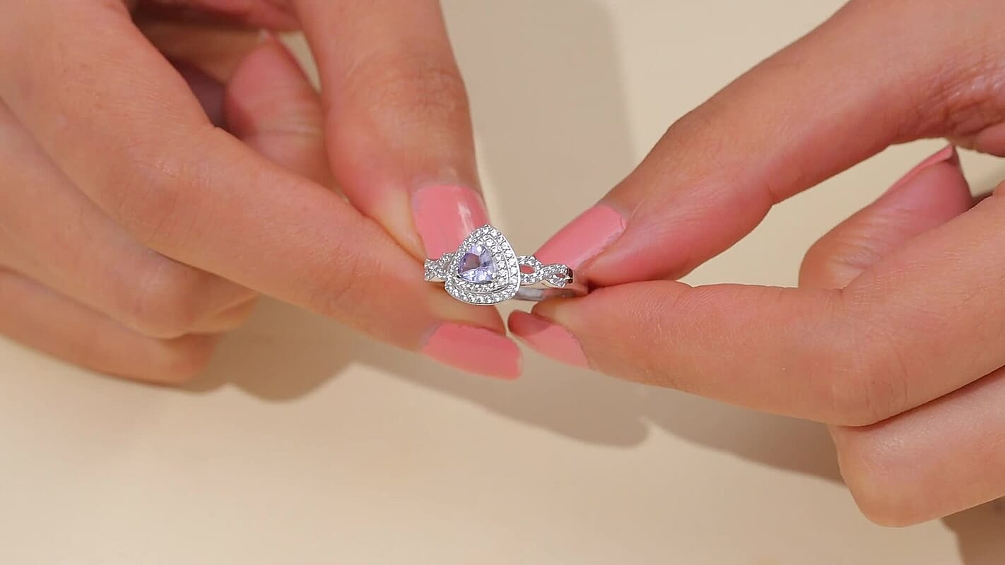 D'Joy Peacock Tanzanite and White Zircon 1.00 ctw Infinity Ring in Rhodium Over Sterling Silver (Size 10.0)