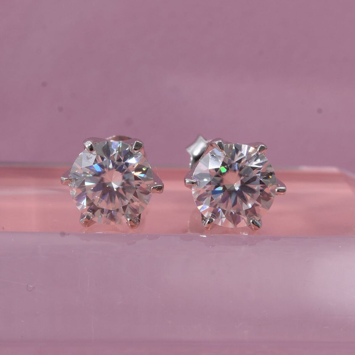 D'Joy Heart and Arrow Cut 161 Facets Moissanite 1.90 ctw Solitaire Stud Earrings in Rhodium OverSterling Silver image number 1