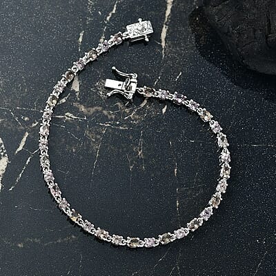 D'Joy Madagascar Color Change Garnet and Moissanite 6.60 ctw Classic Tennis Bracelet in Rhodium Over Sterling Silver (7.25 In)