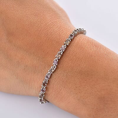 D'Joy Madagascar Color Change Garnet and Moissanite 6.60 ctw Classic Tennis Bracelet in Rhodium Over Sterling Silver (7.25 In)