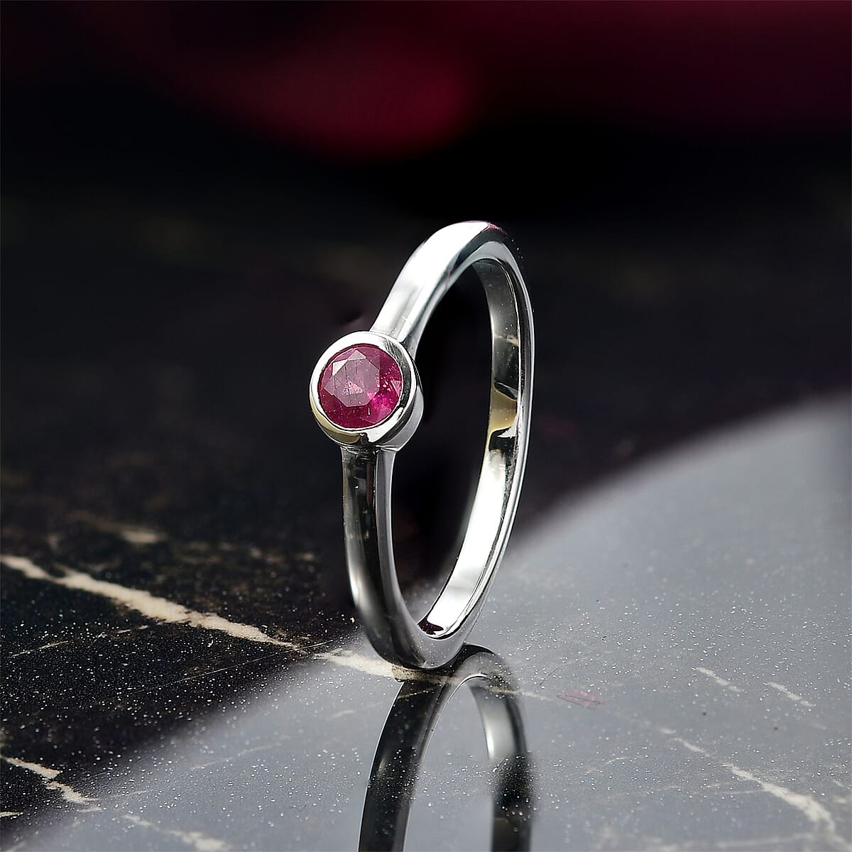 D'Joy Poke Free Niassa Ruby (FF) 9.0) 0.35 ctw Solitaire Ring in Rhodium Over Sterling Silver (Size 10.0) image number 1