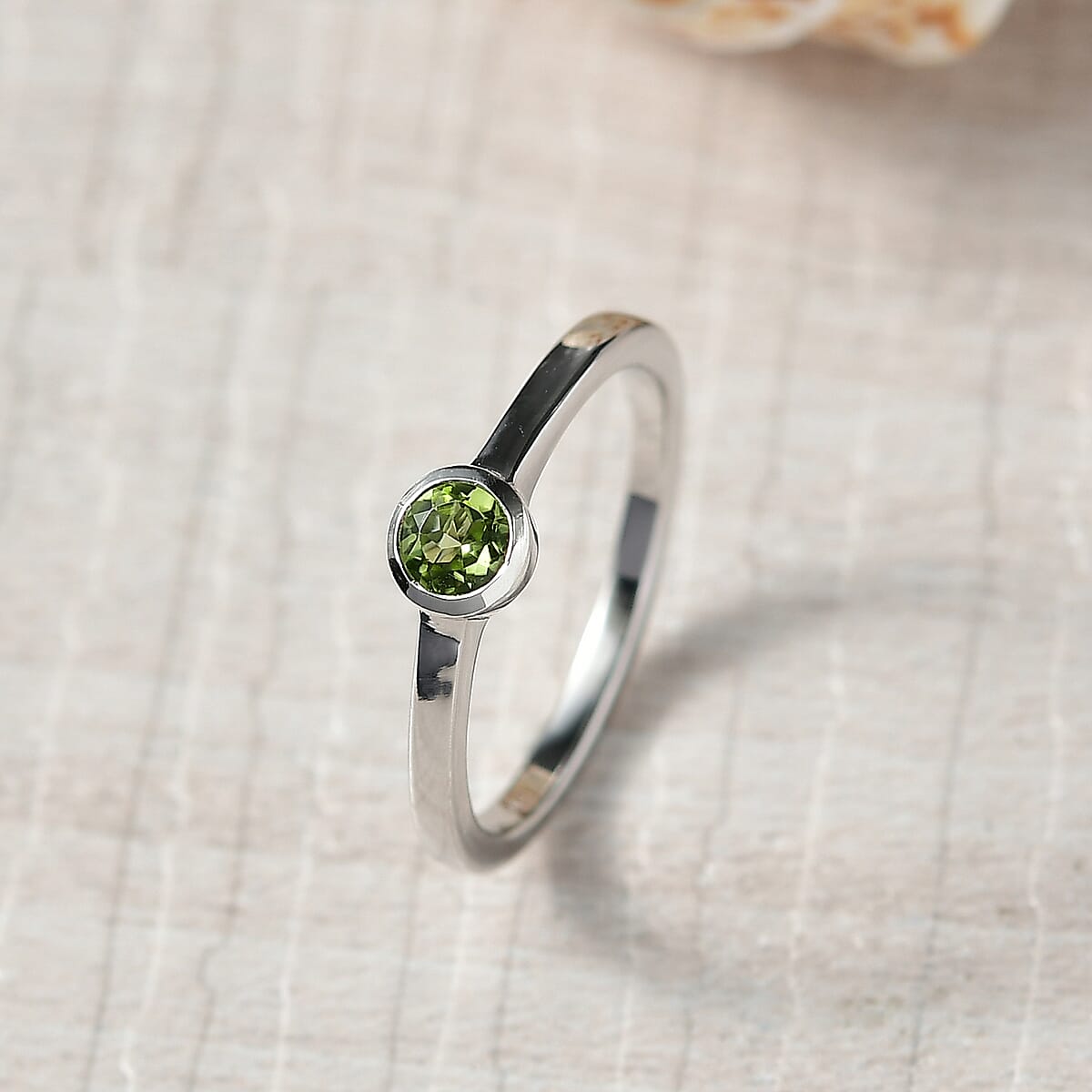 D'Joy Poke Free Peridot 0.30 ctw Solitaire Ring in Rhodium Over Sterling Silver (Size 6.0) image number 1