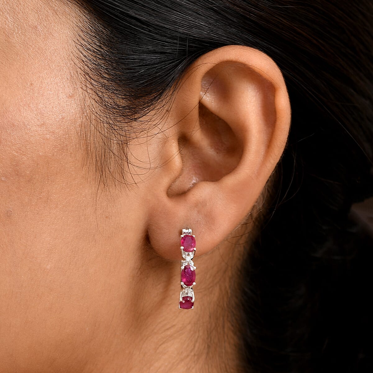 Doorbuster D'Joy Niassa Ruby (FF) and White Zircon 3.80 ctw Four Leaf Clover Hoop Earrings in Rhodium Over Sterling Silver image number 2