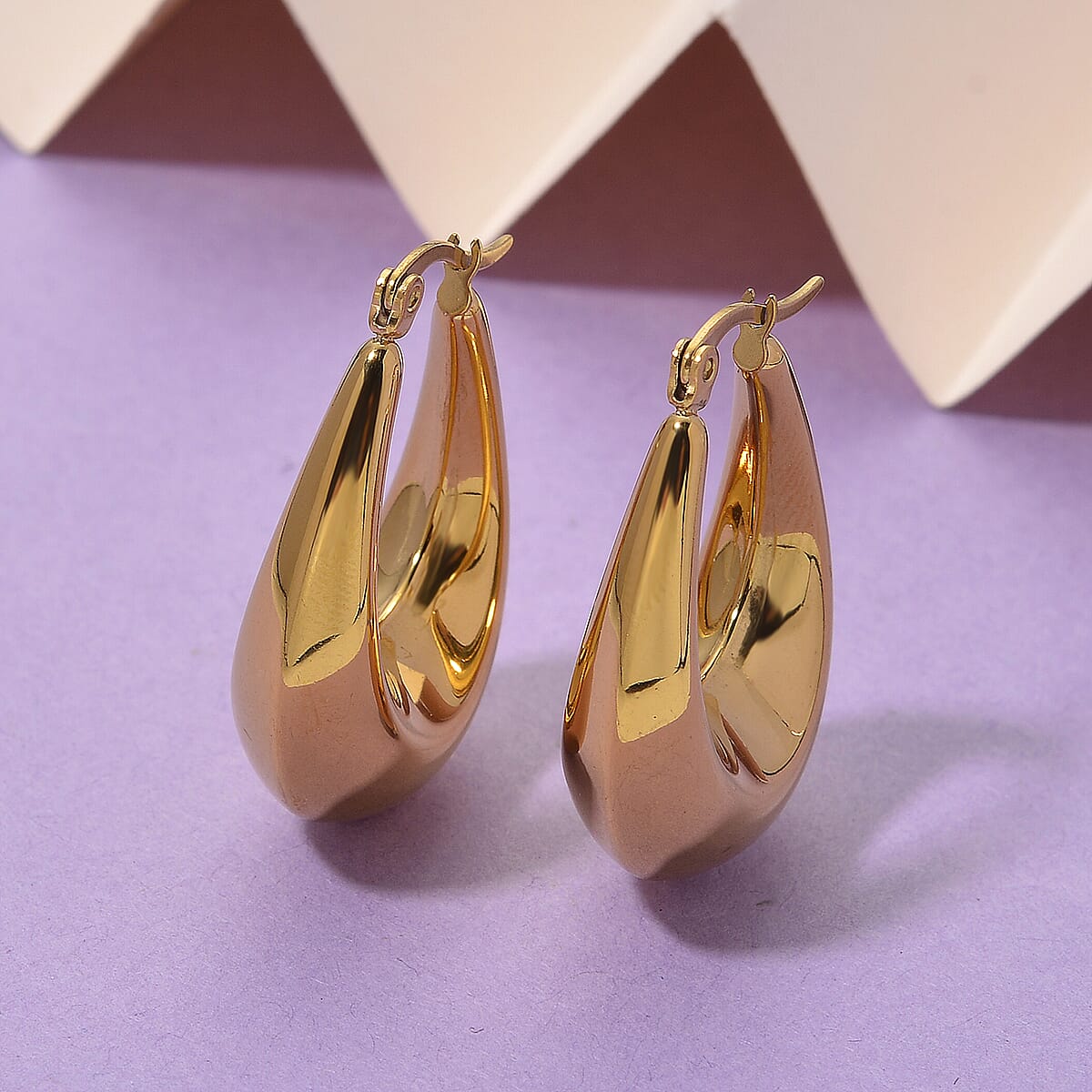Oval Hoop Earrings in ION Plated YG Stainless Steel image number 1
