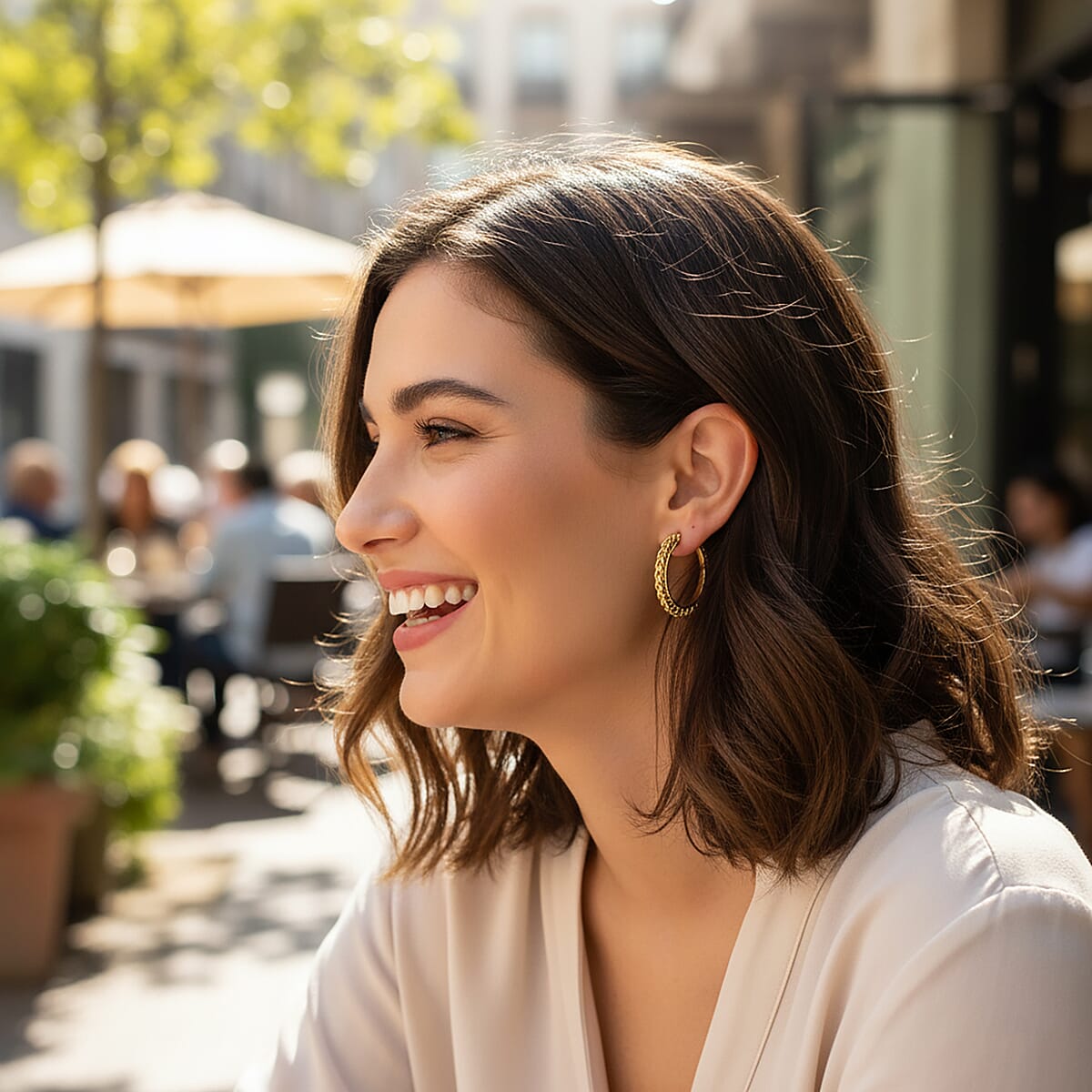 Criss Cross Hoop Earrings in ION Plated YG Stainless Steel image number 2
