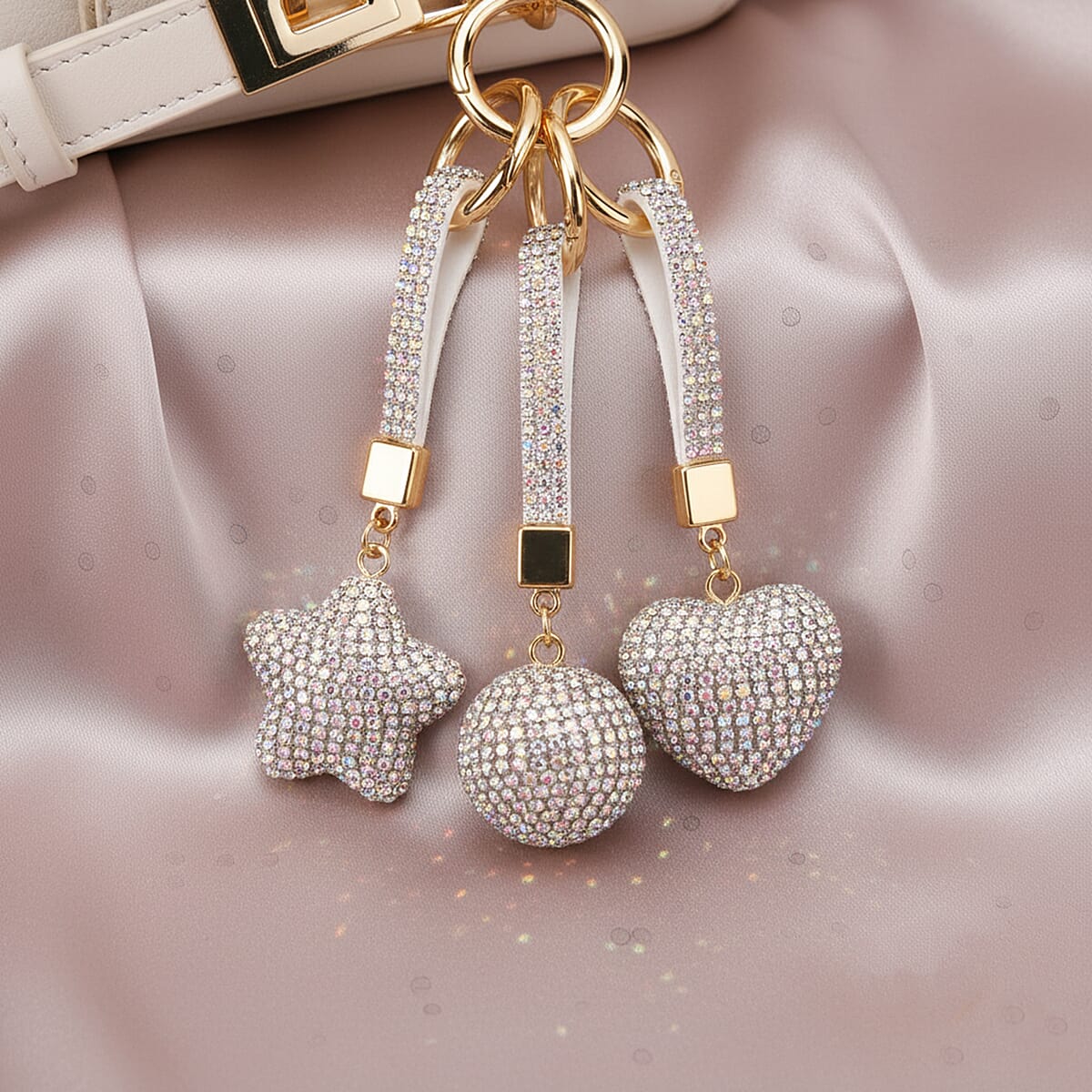  Livmore White Magic Color Glass and Crystal 3-piece Set Heart, Ball and Star Keychain in Goldtone image number 1