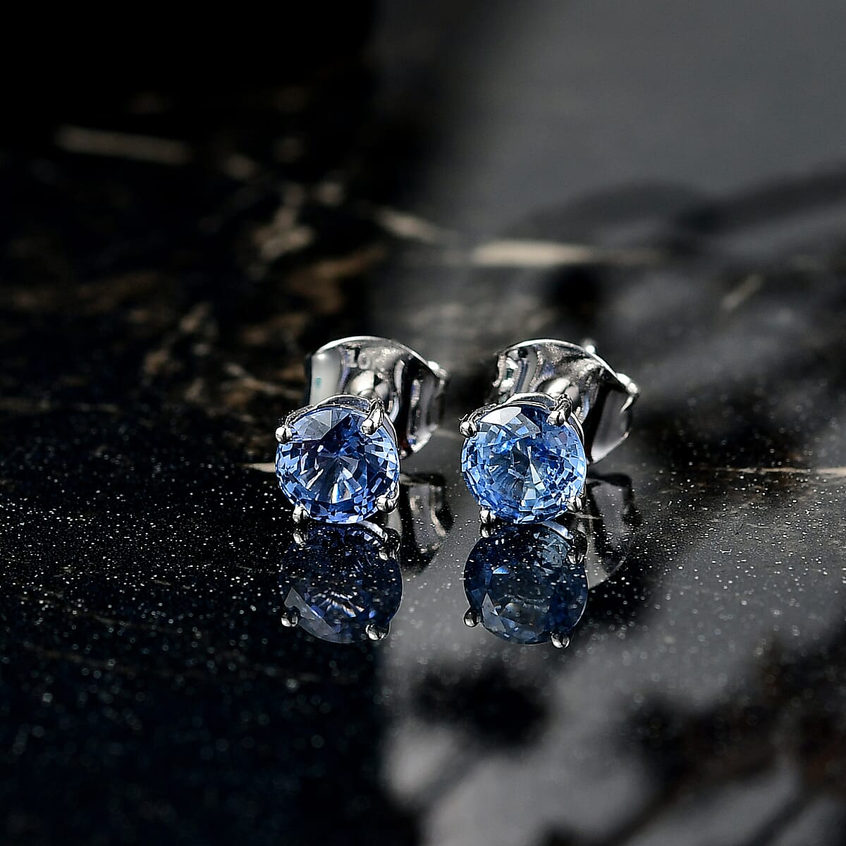 AAA Ceylon Blue Sapphire 1.25 ctw Solitaire Stud Earrings in 10K White Gold image number 1