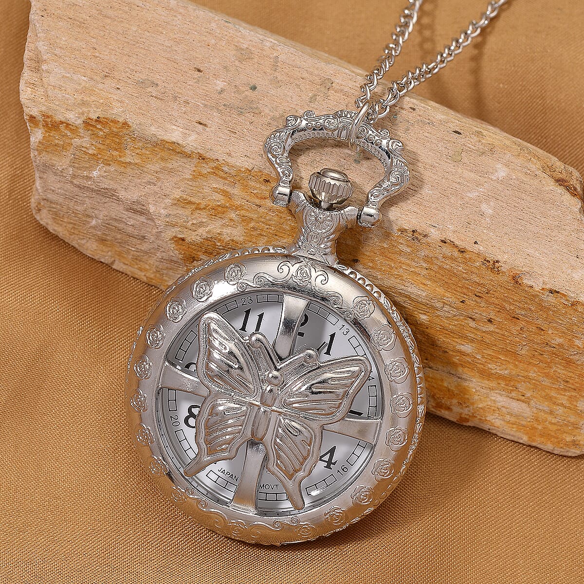 Strada Japanese Movement Rose Pattern Rotating Butterfly Pocket Watch with Chain (36 Inches) in Silvertone image number 1